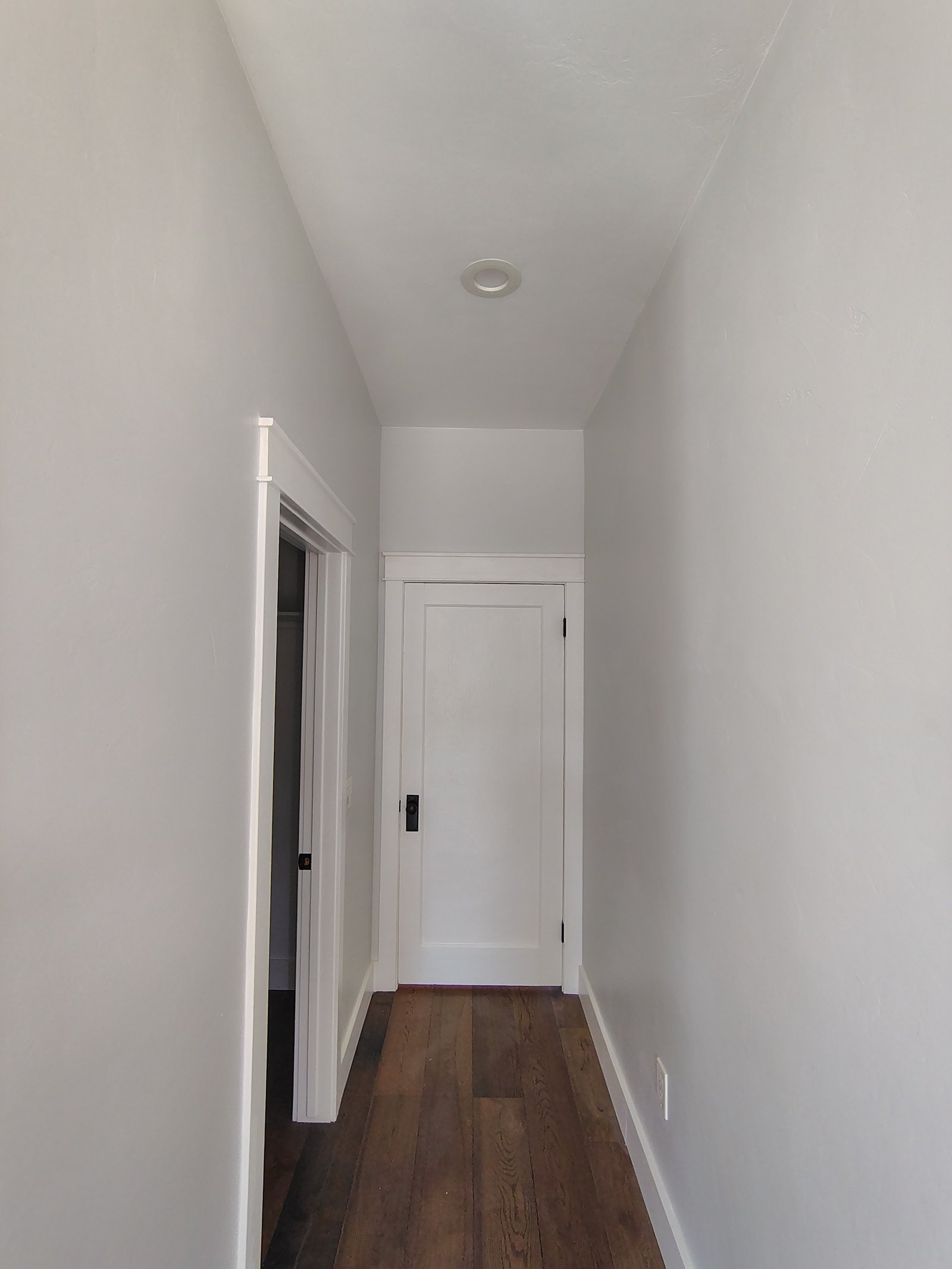 Completed hallway renovation dark hardwood floors new doors Tucson AZ