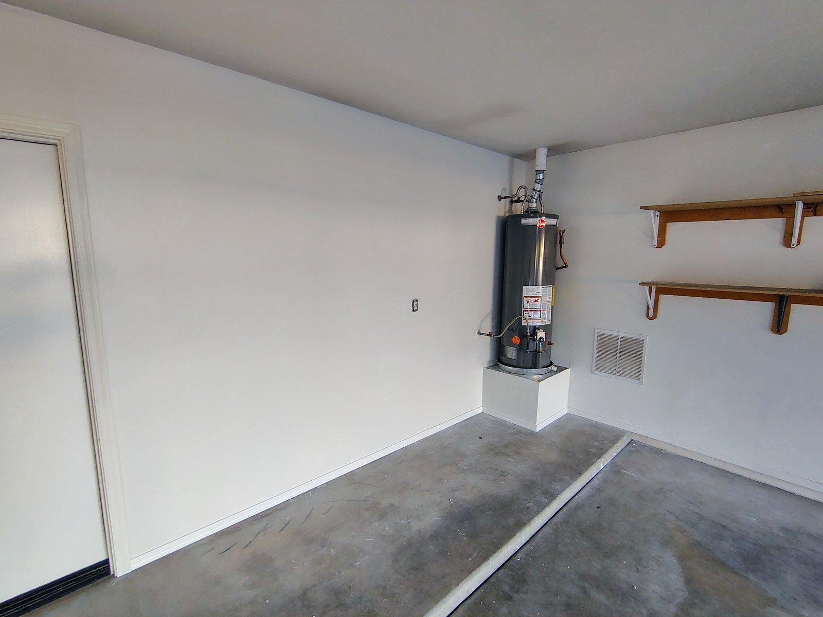 Garage drywall complete with water heater Tucson AZ