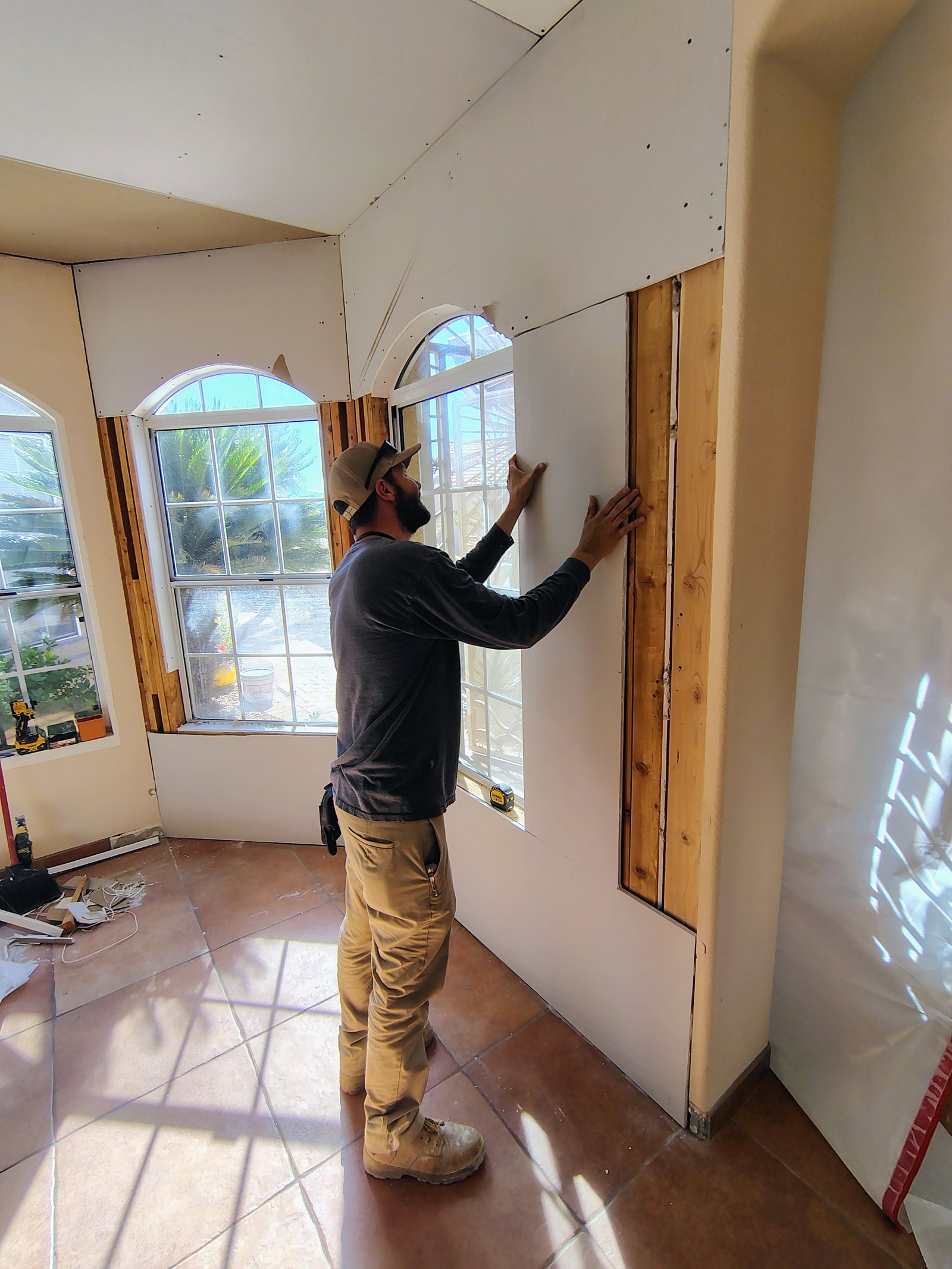 Drywall installation around arched windows Tucson AZ