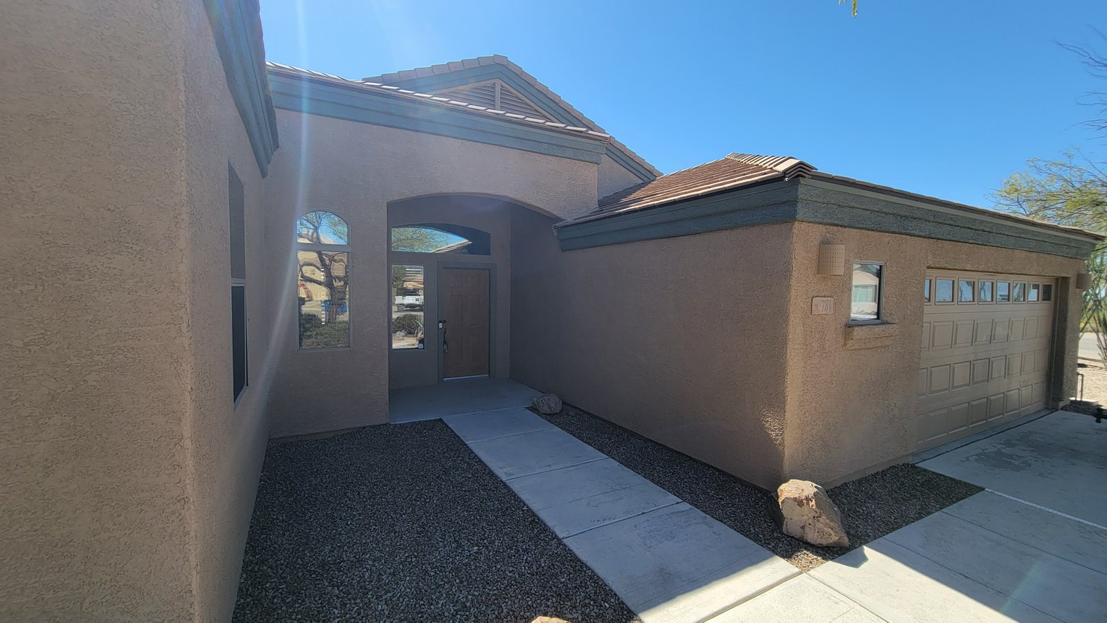 Completed exterior renovation with new front door Tucson AZ
